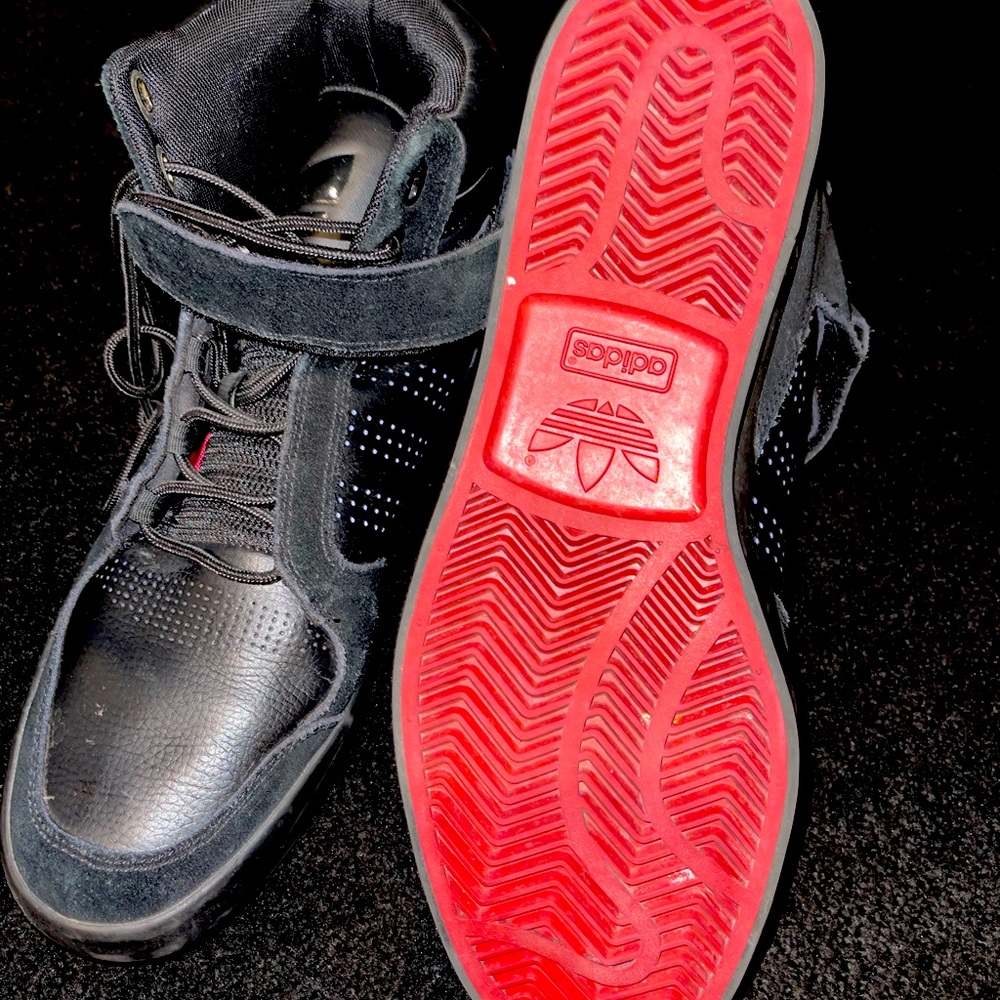 Adidas black Hi-Top with red bottoms size 11